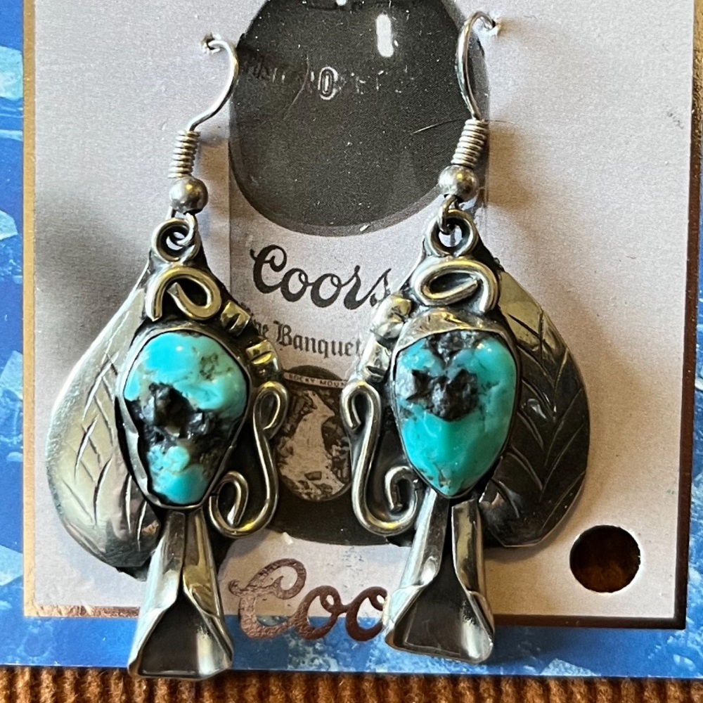 Vintage nickel silver southwestern squash blossom turquoise earrings.